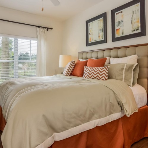 Beautiful bedrooms to fit every need a bedroom with a bed and a fan