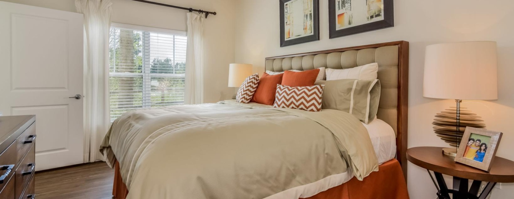 a bedroom with a bed and a fan