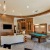a large room with a pool table and a tv
