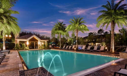 a pool with chairs around it