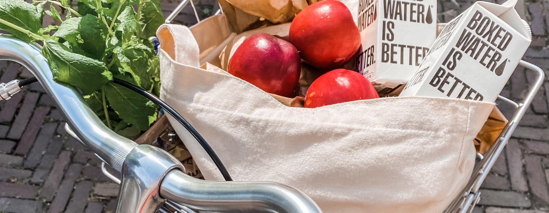 a bicycle with a basket full of vegetables