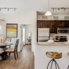 kitchen with barstools and dining room table with chairs